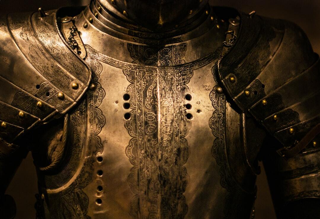 closeup of the breast section of ornate brass war armor