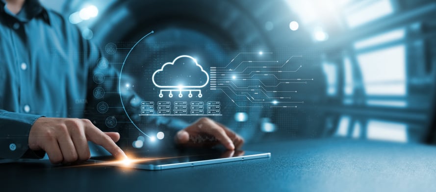 hands on a tablet with overlay of cloud architecture