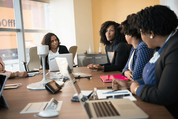 a group of nonprofit professionals collaborating around a table