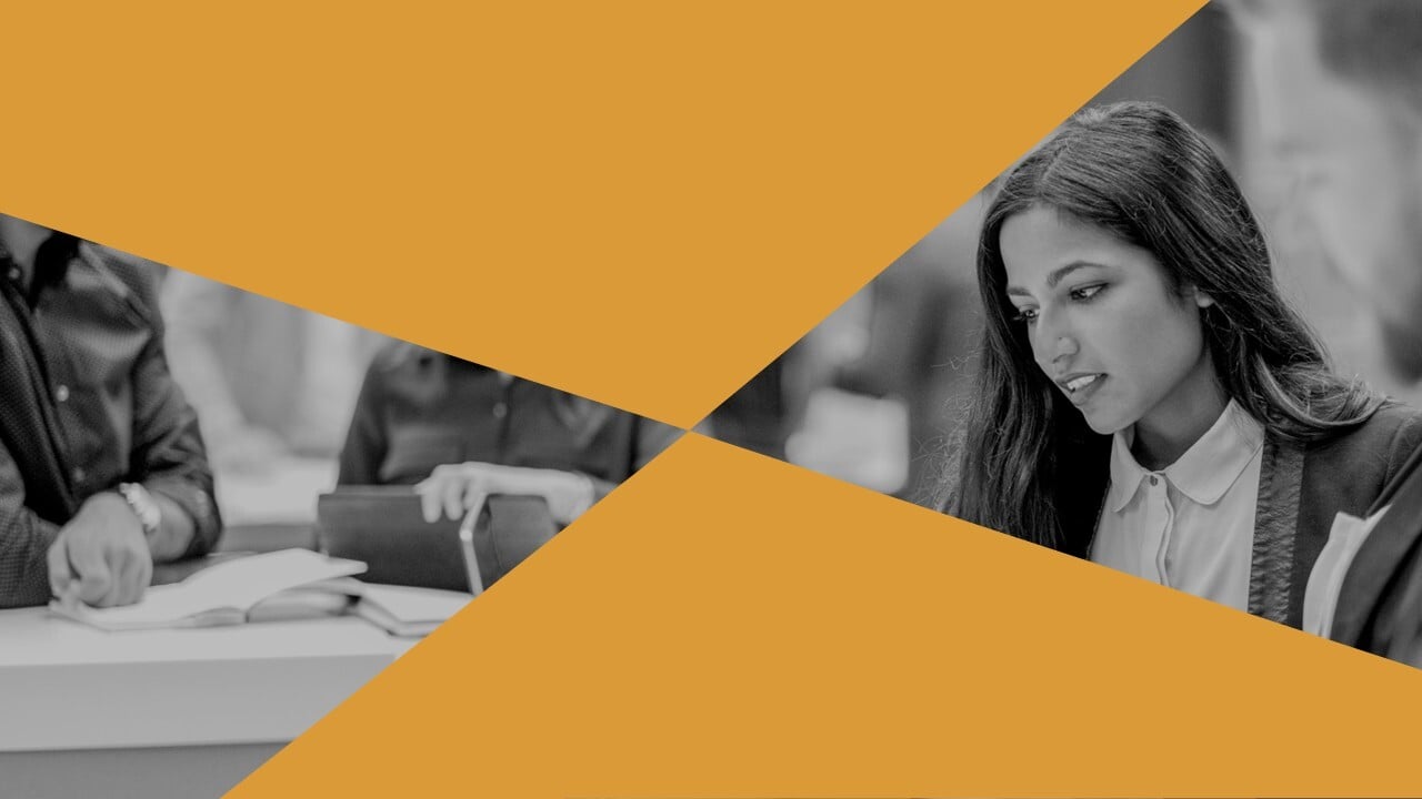 professional sitting at table with other people