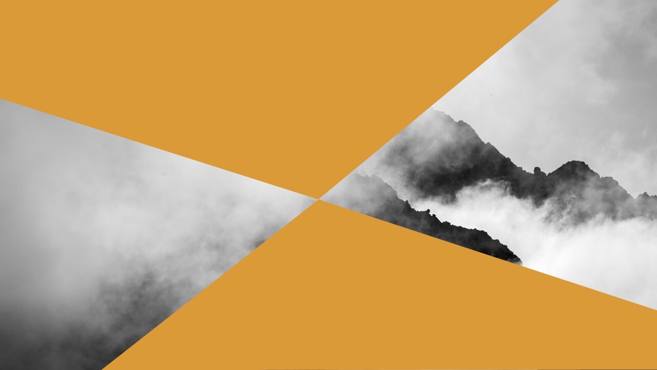 mountains enshrouded in clouds with geometric shape overlay